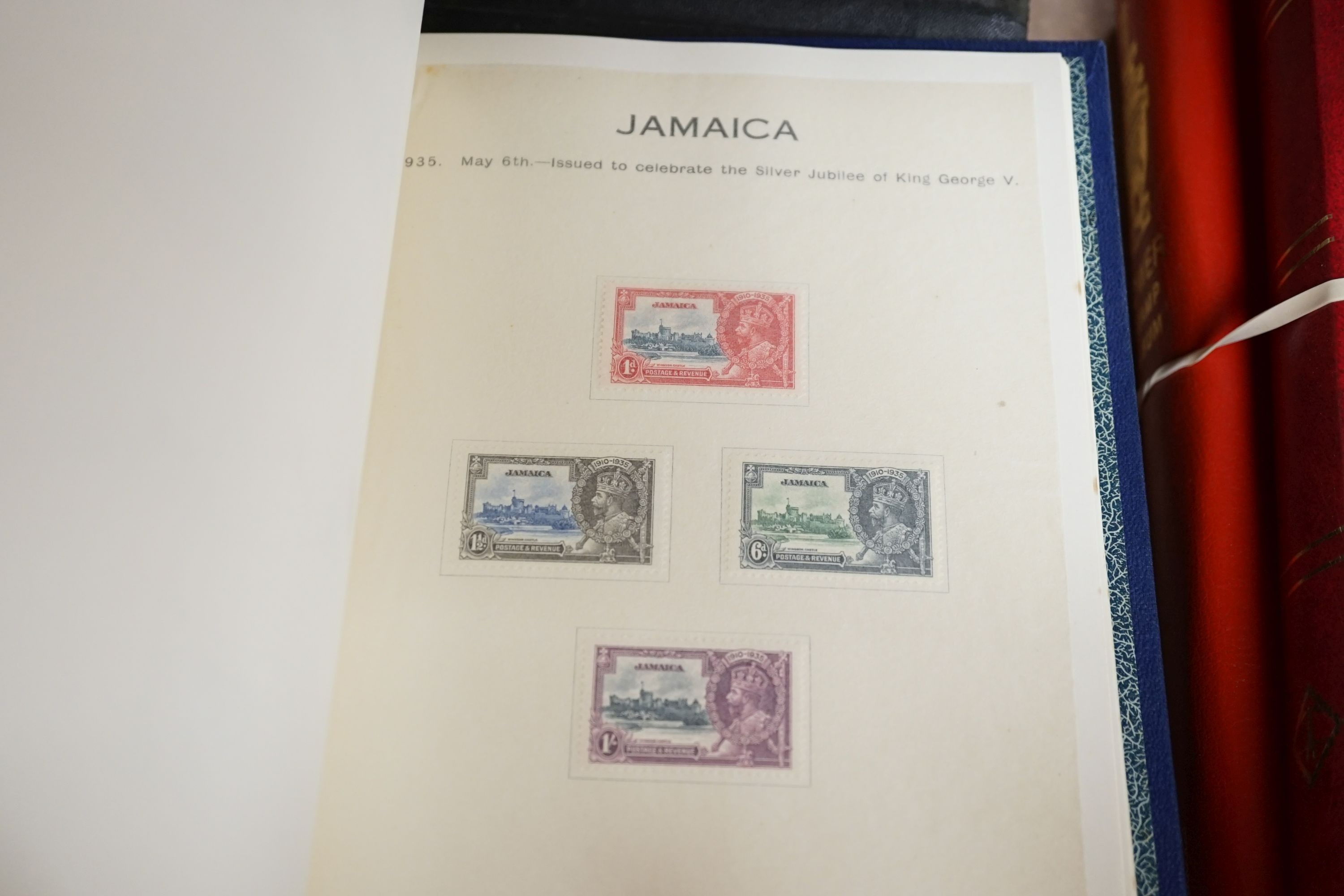 Three stamp albums with 1935 Silver Jubilee mint set of 250 including Egypt, 1937 Coronation two mint sets plus some used